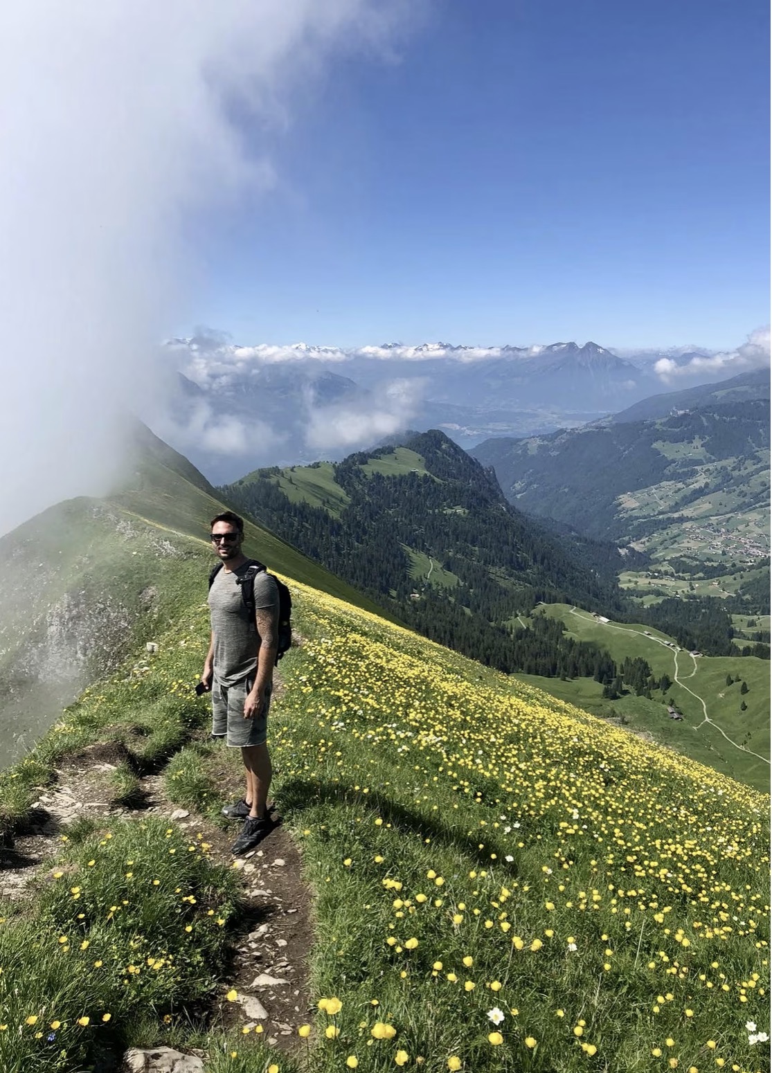 Ronny on an alpine ridge trail overlooking the region
