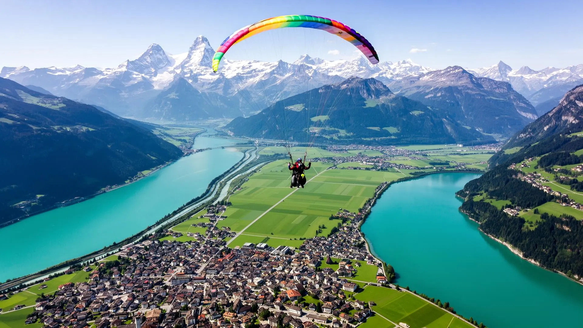 Tandem paraglider above Interlaken between Lake Thun and Lake Brienz